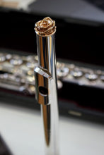 Gold Steel Rose Design flute crown on a vintage Haynes flute